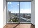 Panoramic city skyline through grand windows, highlighting the urban view at 1065 Peachtree Ne St # 3504, Atlanta, GA 30309
