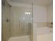 Modern bathroom featuring tile shower and soaking tub at 2304 Shetley Creek Dr, Norcross, GA 30071