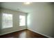 Bedroom with hardwood floors, bright windows, and neutral paint at 2304 Shetley Creek Dr, Norcross, GA 30071