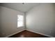Bedroom with hardwood floors, neutral paint, and a bright window at 2304 Shetley Creek Dr, Norcross, GA 30071