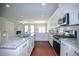Bright, open kitchen with granite countertops, stainless steel appliances, and an island sink at 2304 Shetley Creek Dr, Norcross, GA 30071