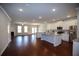 Open-concept kitchen and living area featuring granite countertops and stainless steel appliances at 2304 Shetley Creek Dr, Norcross, GA 30071