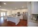 Well-lit kitchen featuring stainless steel appliances, granite counters, and a central island at 2304 Shetley Creek Dr, Norcross, GA 30071