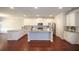 Spacious kitchen boasting granite counters, stainless appliances, and hardwood flooring at 2304 Shetley Creek Dr, Norcross, GA 30071