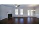 Inviting living room with fireplace, hardwood flooring, and stylish lighting at 2304 Shetley Creek Dr, Norcross, GA 30071