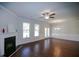 Bright living room featuring a fireplace, hardwood floors, and natural light at 2304 Shetley Creek Dr, Norcross, GA 30071