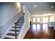 Hardwood staircase leading to open living room and kitchen area at 2304 Shetley Creek Dr, Norcross, GA 30071