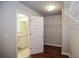 Open door to the walk-in closet and bathroom with granite countertop at 2304 Shetley Creek Dr, Norcross, GA 30071