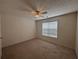 Cozy bedroom with natural light and ceiling fan at 2840 Alcovy River Vw, Dacula, GA 30019
