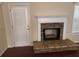 Fireplace with stone hearth and door to porch at 2840 Alcovy River Vw, Dacula, GA 30019
