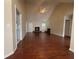 Open-concept living area with hardwood floors, a fireplace, and ample natural light at 2840 Alcovy River Vw, Dacula, GA 30019