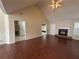 Bright living room boasting hardwood floors, a fireplace, and access to the backyard at 2840 Alcovy River Vw, Dacula, GA 30019