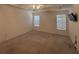 Main bedroom featuring a tray ceiling, carpeted floors, and natural light at 2840 Alcovy River Vw, Dacula, GA 30019