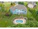 Aerial view of blue house featuring a large backyard with a pool and fence at 300 Towne Overlook Cir, Canton, GA 30114