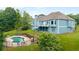 Home featuring a large backyard with a pool and greenery at 300 Towne Overlook Cir, Canton, GA 30114