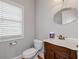 Powder room featuring a classic vanity with a marble countertop and vintage style faucet at 300 Towne Overlook Cir, Canton, GA 30114