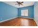 Cozy bedroom featuring hardwood floors, natural light, and closet at 300 Towne Overlook Cir, Canton, GA 30114