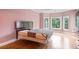 Bedroom with hardwood floors, large windows and light pink walls at 300 Towne Overlook Cir, Canton, GA 30114