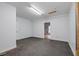 Bonus room featuring concrete flooring, neutral walls, and a door that leads to another room at 300 Towne Overlook Cir, Canton, GA 30114