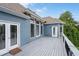 Large outdoor deck with white patio doors and awning, perfect for entertaining in this well maintained home at 300 Towne Overlook Cir, Canton, GA 30114