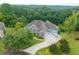 Craftsman home with long drive and well manicured lawn and mature trees at 300 Towne Overlook Cir, Canton, GA 30114