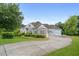 View of the house showcasing the facade, 2-car garage and long driveway at 300 Towne Overlook Cir, Canton, GA 30114