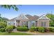 Charming one story home with manicured landscaping, and a brick and light blue facade at 300 Towne Overlook Cir, Canton, GA 30114