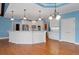 Beautiful kitchen with white cabinets, granite countertops, and modern lighting at 300 Towne Overlook Cir, Canton, GA 30114