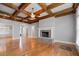 Bright living room features a fireplace, coffered ceiling, and hardwood floors at 300 Towne Overlook Cir, Canton, GA 30114
