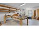 Workshop featuring a workbench, overhead lighting, and storage shelves at 300 Towne Overlook Cir, Canton, GA 30114