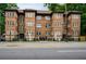 Brick apartment building featuring symmetrical design elements and tidy landscaping at 360 Ponce De Leon Ave Ne # 1, Atlanta, GA 30305
