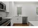 Bright, remodeled kitchen featuring stainless appliances and white cabinetry at 360 Ponce De Leon Ave Ne # 1, Atlanta, GA 30305