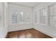 Sunroom with lots of natural light featuring lots of windows and hardwood floors at 360 Ponce De Leon Ave Ne # 1, Atlanta, GA 30305
