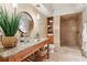 Elegant bathroom with a modern vanity, vessel sink, and walk-in shower at 3903 Hazelhurst Dr, Marietta, GA 30066