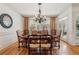 Traditional dining room featuring hardwood floors, chandelier, and seating for eight at 3903 Hazelhurst Dr, Marietta, GA 30066