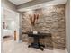 Charming entryway featuring a stone accent wall and stylish console table at 3903 Hazelhurst Dr, Marietta, GA 30066