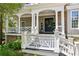 Inviting front porch with stone accents, white columns, and decorative railings, offering a welcoming entrance at 3903 Hazelhurst Dr, Marietta, GA 30066