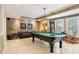 Enjoy a game of billiards in this well-lit game room with a pool table and comfortable seating at 3903 Hazelhurst Dr, Marietta, GA 30066