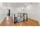 Upstairs hallway with decorative wainscoting and hardwood floors at 3903 Hazelhurst Dr, Marietta, GA 30066