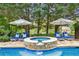 A close up on the in-ground hot tub which features flagstone and a small waterfall flowing into the pool at 3903 Hazelhurst Dr, Marietta, GA 30066