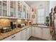 Butler's pantry featuring granite counters and white cabinetry at 3903 Hazelhurst Dr, Marietta, GA 30066