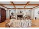 Cozy living room featuring a fireplace, wood-beamed ceiling, and comfortable seating arrangement at 3903 Hazelhurst Dr, Marietta, GA 30066