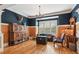 Traditional living room with wood paneling and a comfortable seating arrangement at 3903 Hazelhurst Dr, Marietta, GA 30066