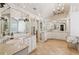 Bright main bathroom with dual vanities, tile floors, and a decorative chandelier at 3903 Hazelhurst Dr, Marietta, GA 30066