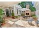 Charming outdoor patio with a stone fireplace, perfect for relaxation and entertaining at 3903 Hazelhurst Dr, Marietta, GA 30066