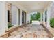 Elegant porte cochere with stone accents and white columns at 3903 Hazelhurst Dr, Marietta, GA 30066