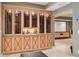 Spacious wine cellar with glass-front cabinets, and room for entertaining at 3903 Hazelhurst Dr, Marietta, GA 30066