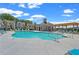 Beautiful community pool with plenty of lounge chairs and seating surrounded by well maintained grounds and neighborhood houses at 657 Summit Hill Way, Cumming, GA 30040