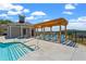 Stunning community pool with a pergola, lounge chairs, pool house, and plenty of room to enjoy the outdoors at 657 Summit Hill Way, Cumming, GA 30040