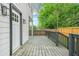 Spacious wood back porch features a railing, yard views, and access to the home at 1090 Mcdaniel St, Atlanta, GA 30310